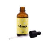 Esencia para difusores de Citronela antimosquitos. Bote de cristal oscuro abierto con pipeta debajo.